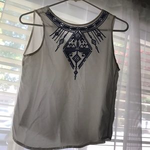 White shirt with blue embroidering